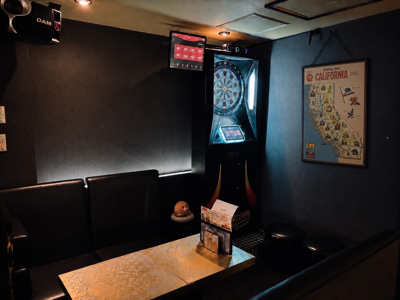 Sofa seats and dartboard